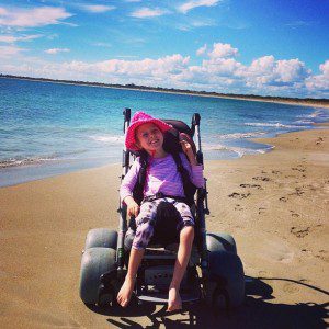 Enjoying the beach in a beach wheelchair